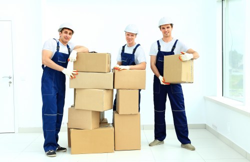 Professional movers loading furniture for a Ham relocation