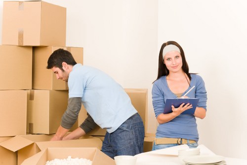 Local small removals team assisting with furniture transport in Ham