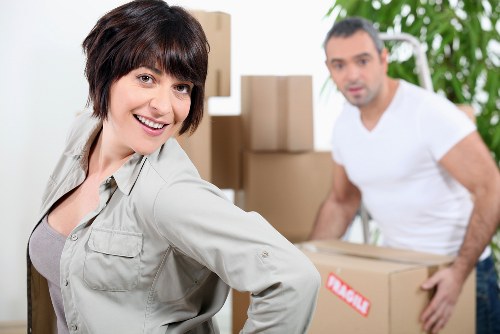 Moving boxes and protected furniture inside a Ham apartment