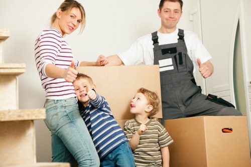 Professional movers packing boxes for a Ham relocation
